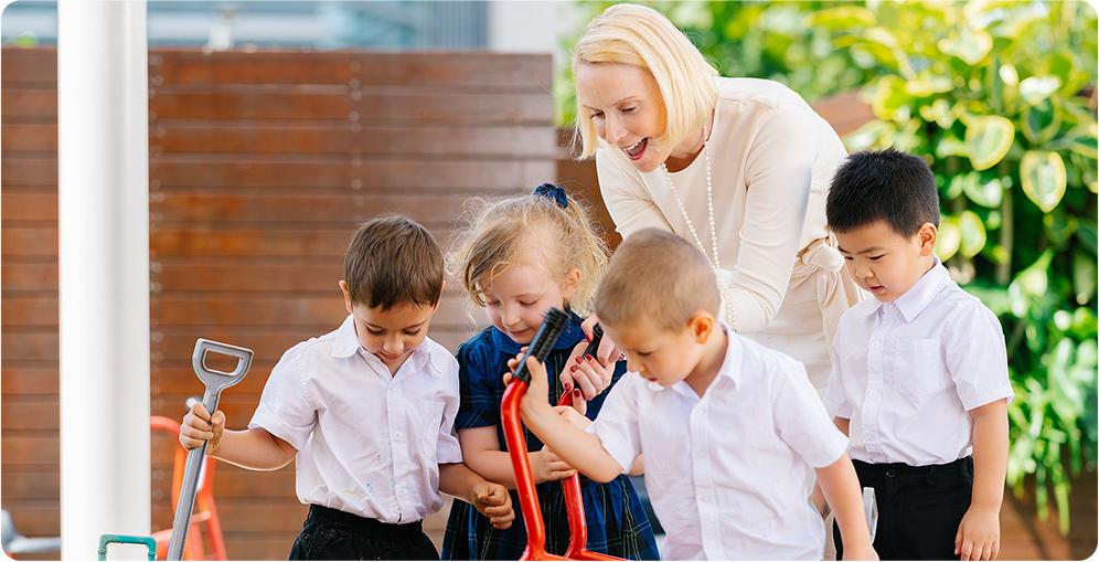 Four Early Years students gardening on the school compounds of Hiba Academy Bay Area, a private international kindergarten in San Francisco offering bilingual education.