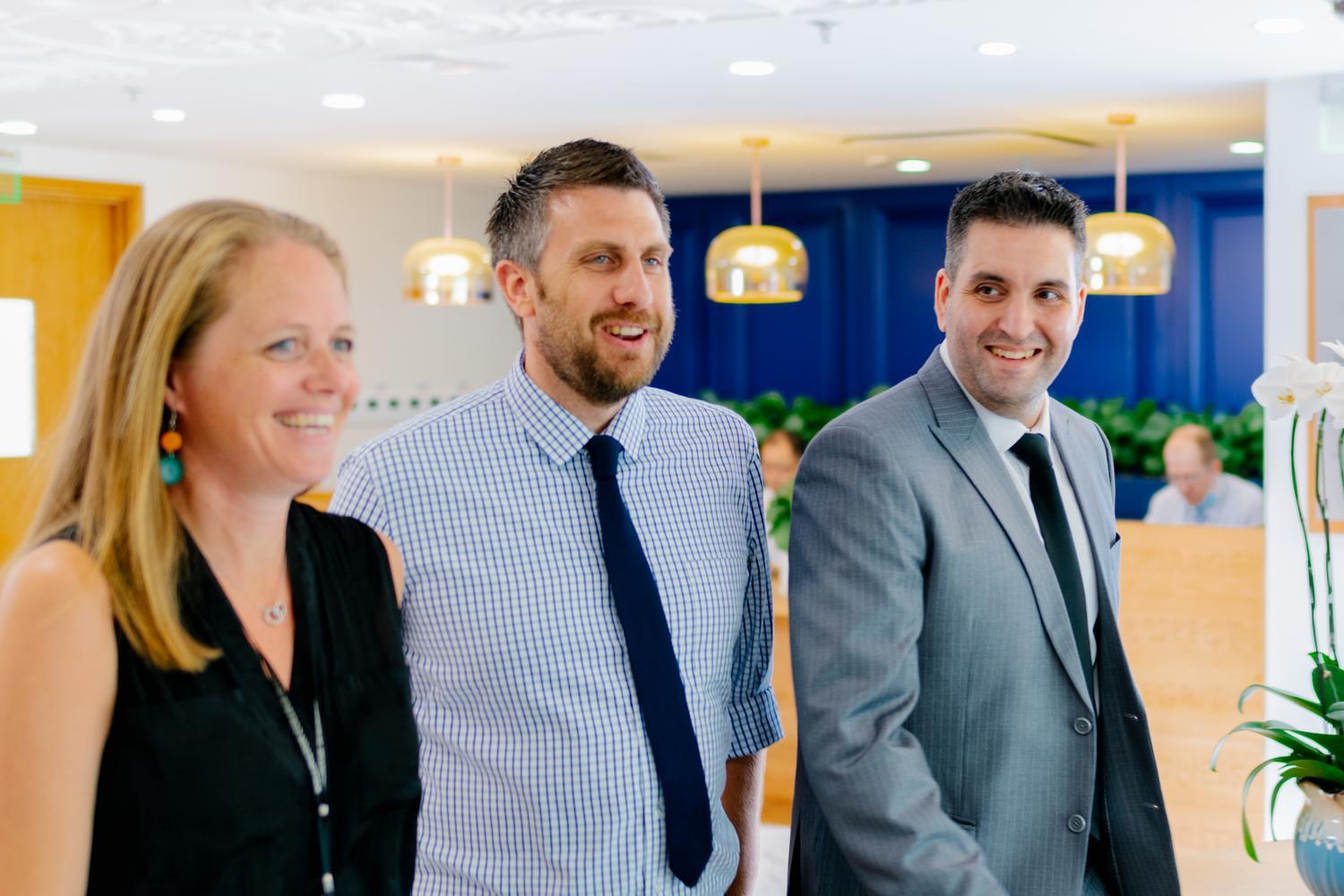 Three international teachers smile as they stand side by side, pleased with the career development and learning opportunities at Hiba Academy Bay Area, an international school in San Francisco.